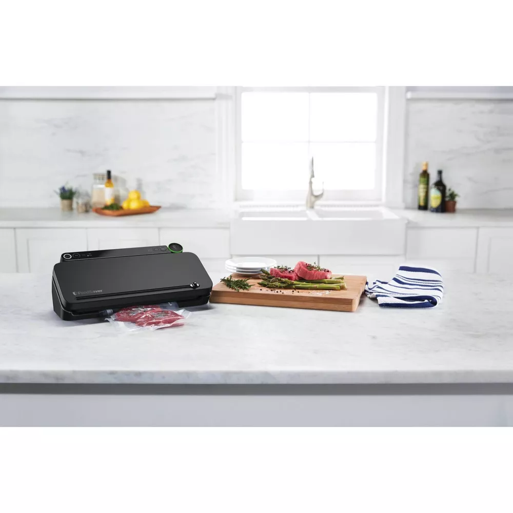 FoodSaver Premier Vacuum Sealer with Dry/Moist/Marinate Modes, Roll Storage and Cutter Bar, and Bags and Roll Starter Kit - Black