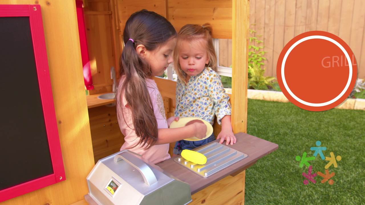 KidKraft Modern Outdoor Wooden Playhouse with Picnic Table, Mailbox and Outdoor Grill