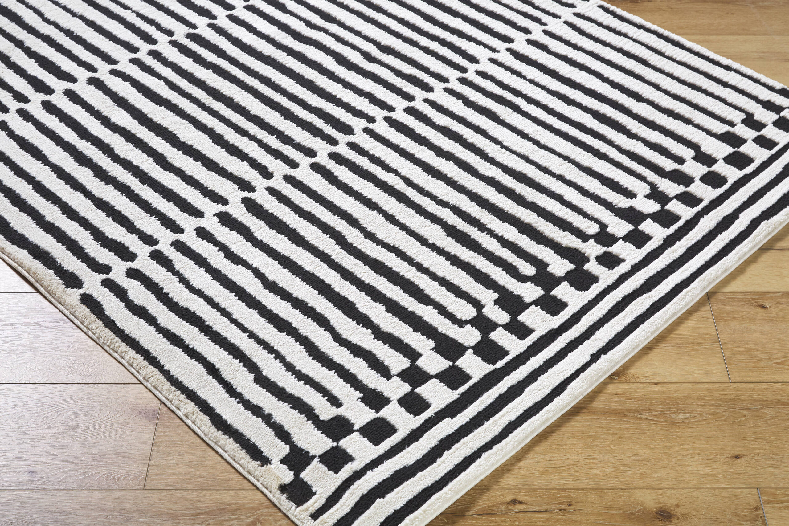 Origin 21 Obsidian Mirage 9 x 12 (ft) Loomed Polyester/Polypropylene Onyx/White Rectangular Indoor Stripe Moroccan Spot Clean Only Pet Friendly Area rug